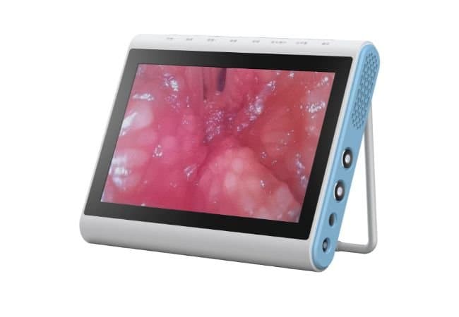 White portable medical monitor with blue trim displaying a close-up endoscopic view of pink tissue.